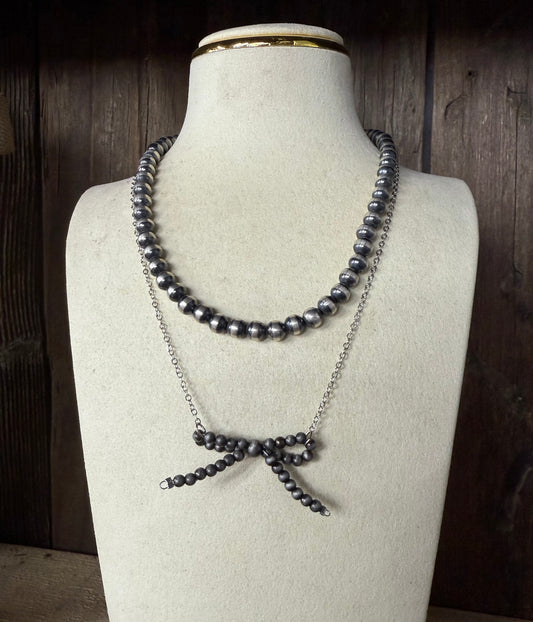 Native American, silver pearl bow inspired necklace
