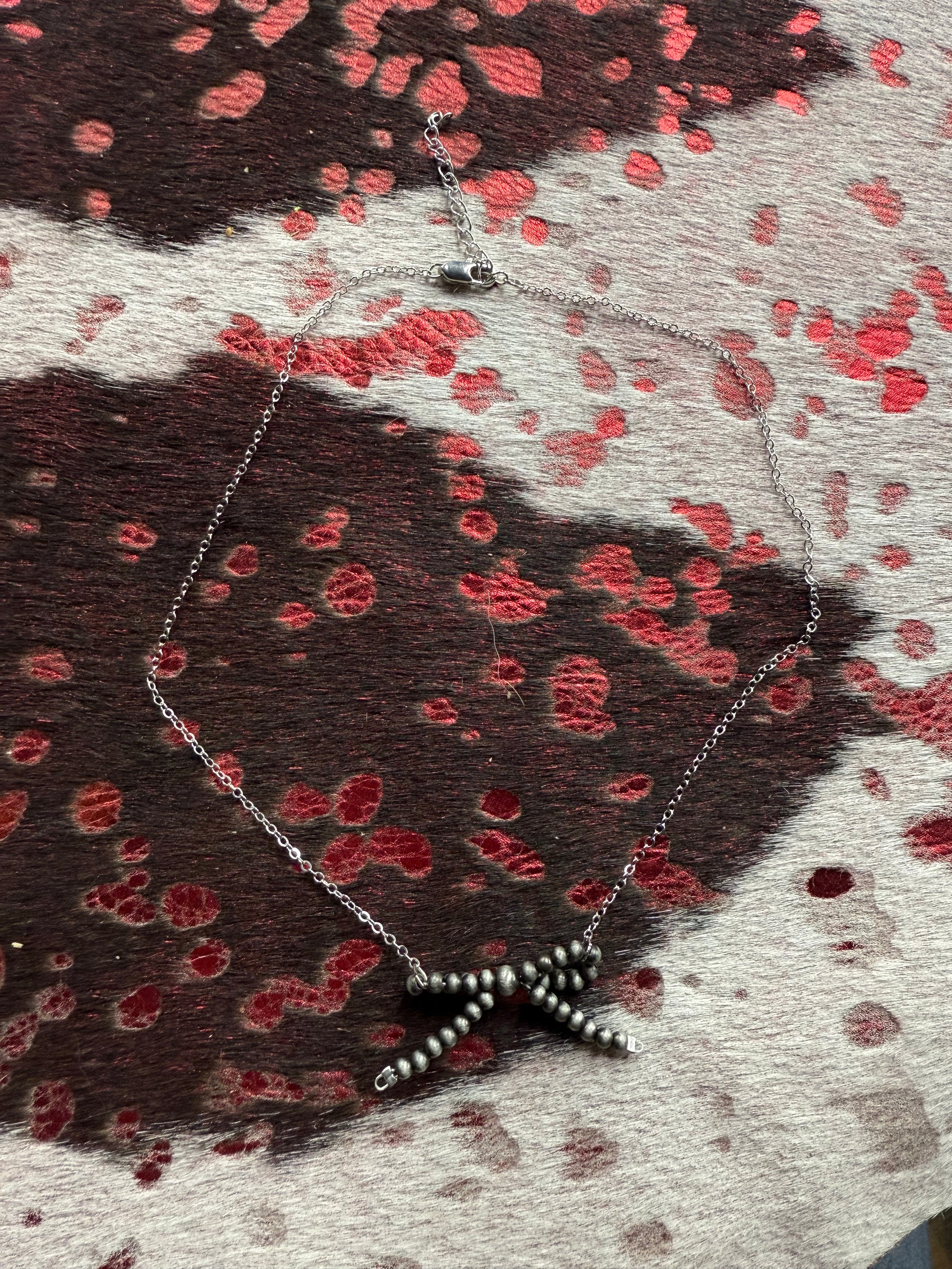 Native American, silver pearl bow inspired necklace