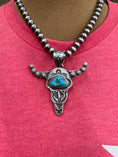 Load image into Gallery viewer, Native American Hand stamped Steerhead pendant complete with 18 inch Sterling Navajo pearls!
